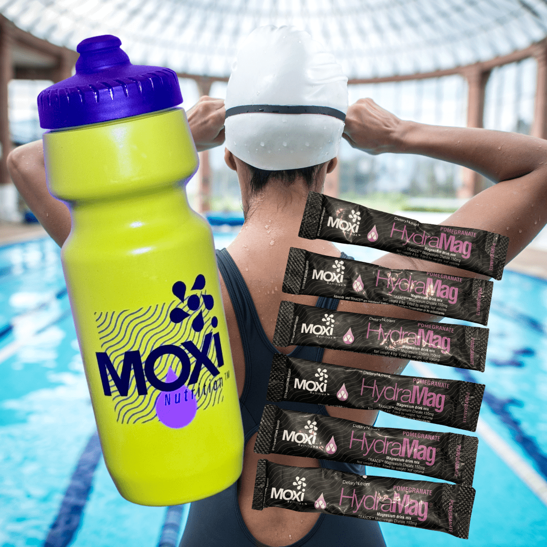 Person holding a Moxi water bottle and Hydramag packets by a pool